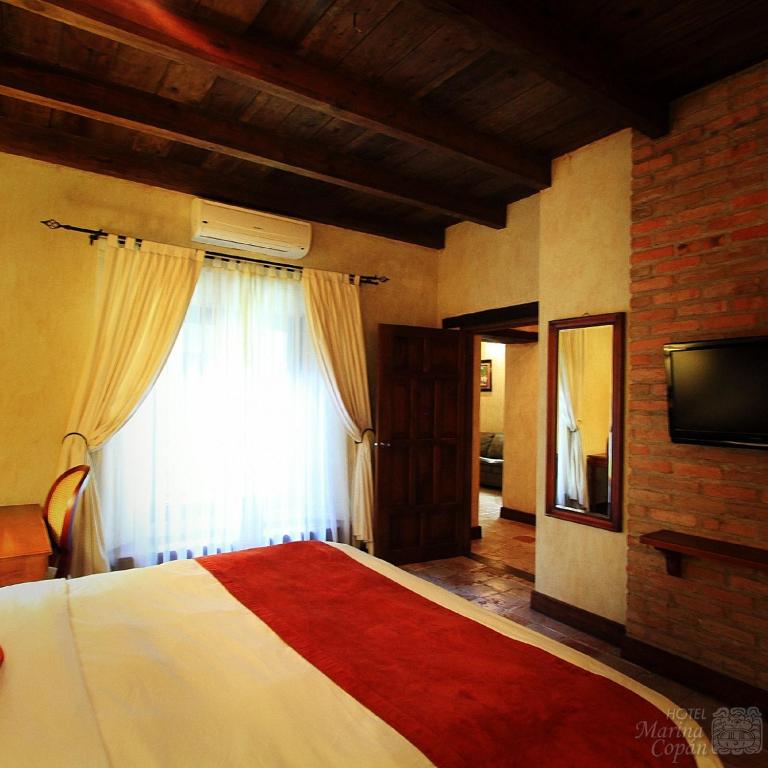 TV a/nebo společenská místnost v ubytování Hotel Marina Copan