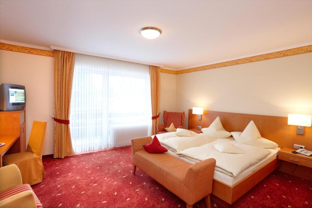 Postel nebo postele na pokoji v ubytování Hotel Hochheide
