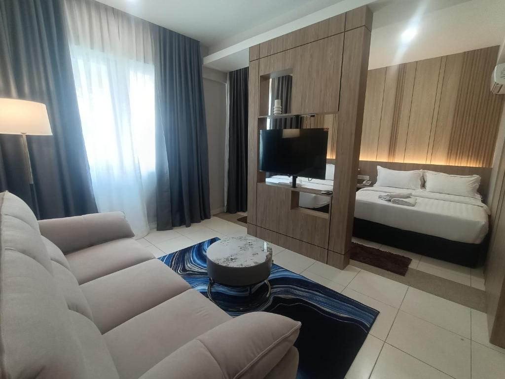 Postel nebo postele na pokoji v ubytování Hotel Golden View Nilai