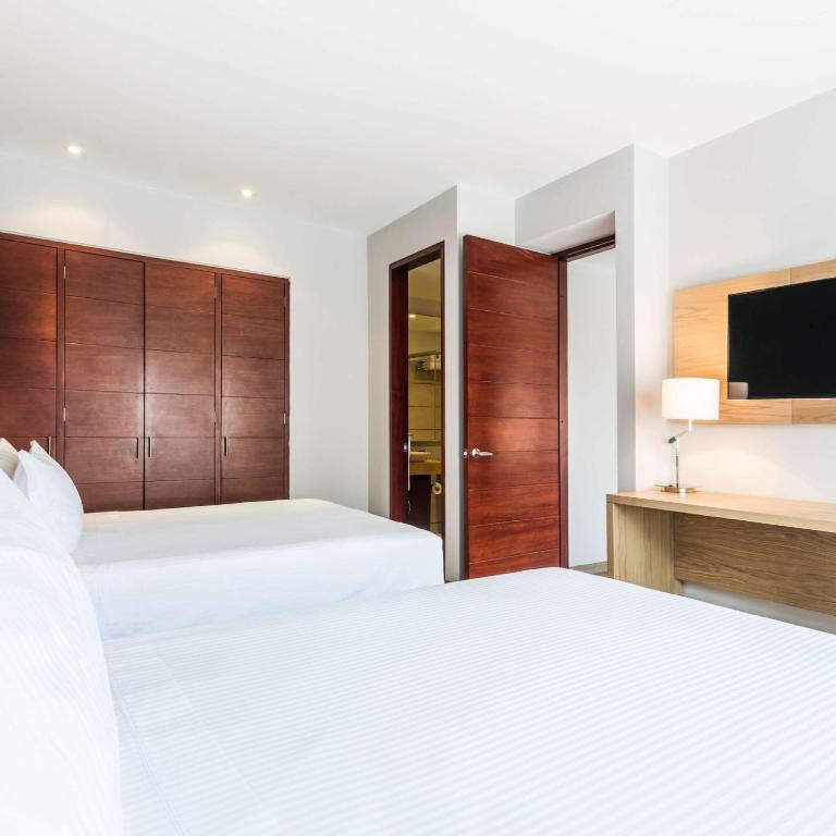 Postel nebo postele na pokoji v ubytování Cosmos 100 Hotel & Centro de Convenciones - Hoteles Cosmos