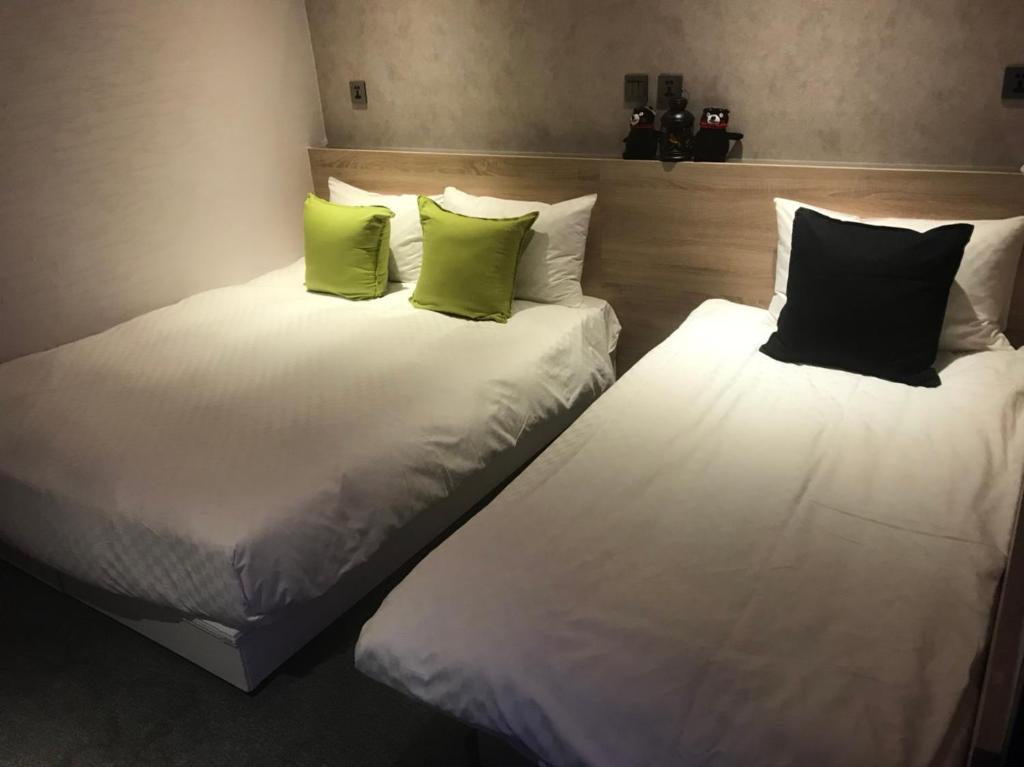 Postel nebo postele na pokoji v ubytování Art Inn - Kaifeng