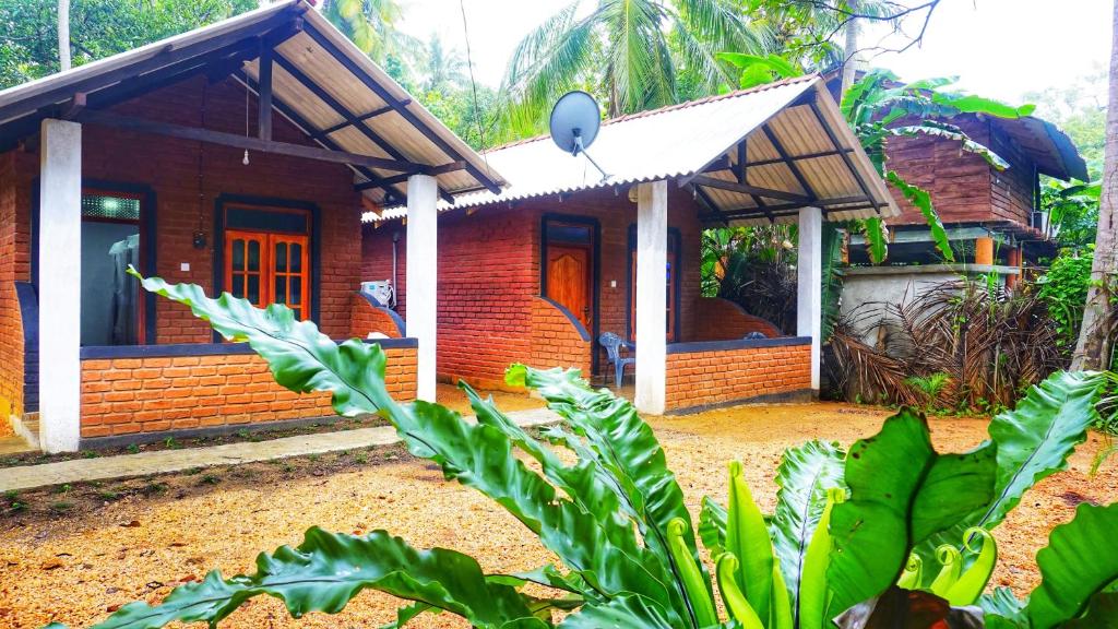 Zahrada ubytování Osheen Homestay Sigiriya