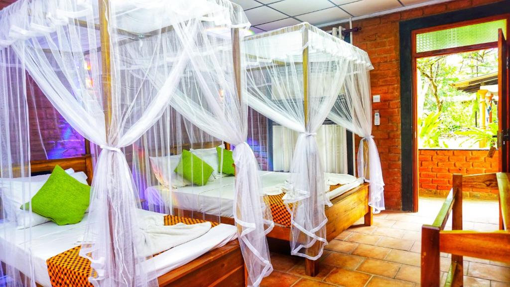 Postel nebo postele na pokoji v ubytování Osheen Homestay Sigiriya