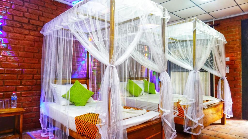 Postel nebo postele na pokoji v ubytování Osheen Homestay Sigiriya