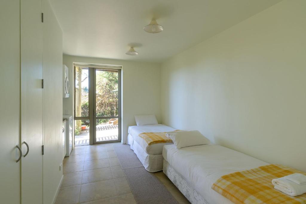 Postel nebo postele na pokoji v ubytování Elevated Views Little Kaiteriteri 3 bedrooms