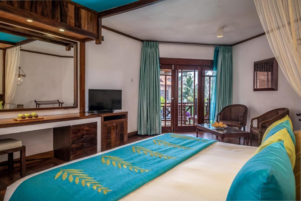 Postel nebo postele na pokoji v ubytování Royal Palms Beach Hotel