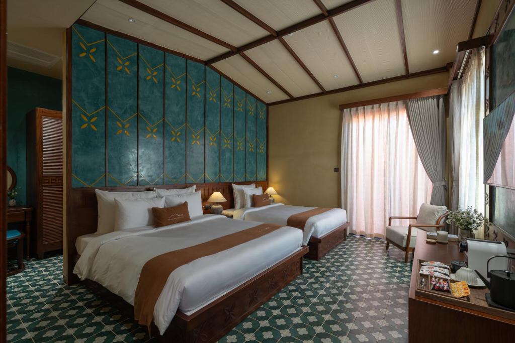Giường trong phòng chung tại The Mist Boutique DaLat Hotel