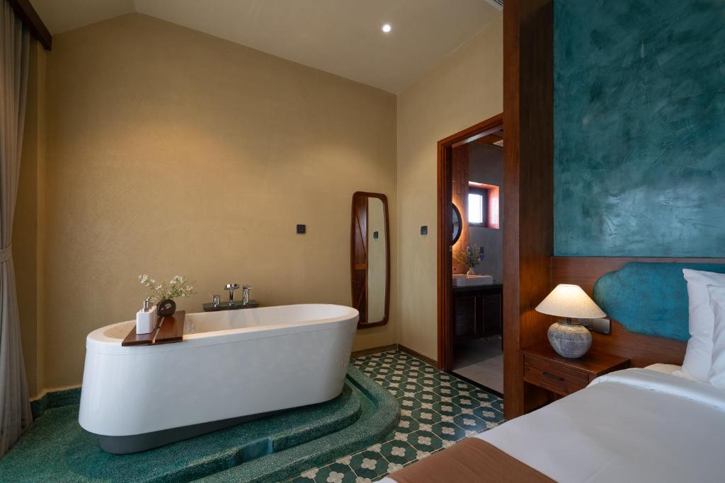Giường trong phòng chung tại The Mist Boutique DaLat Hotel