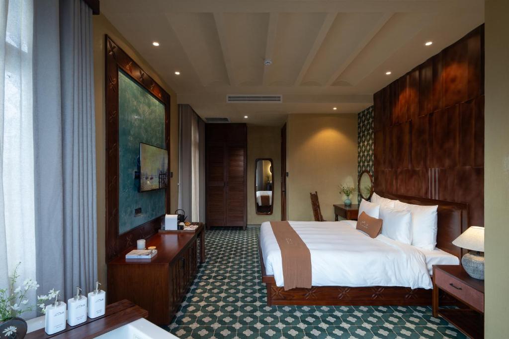 Giường trong phòng chung tại The Mist Boutique DaLat Hotel