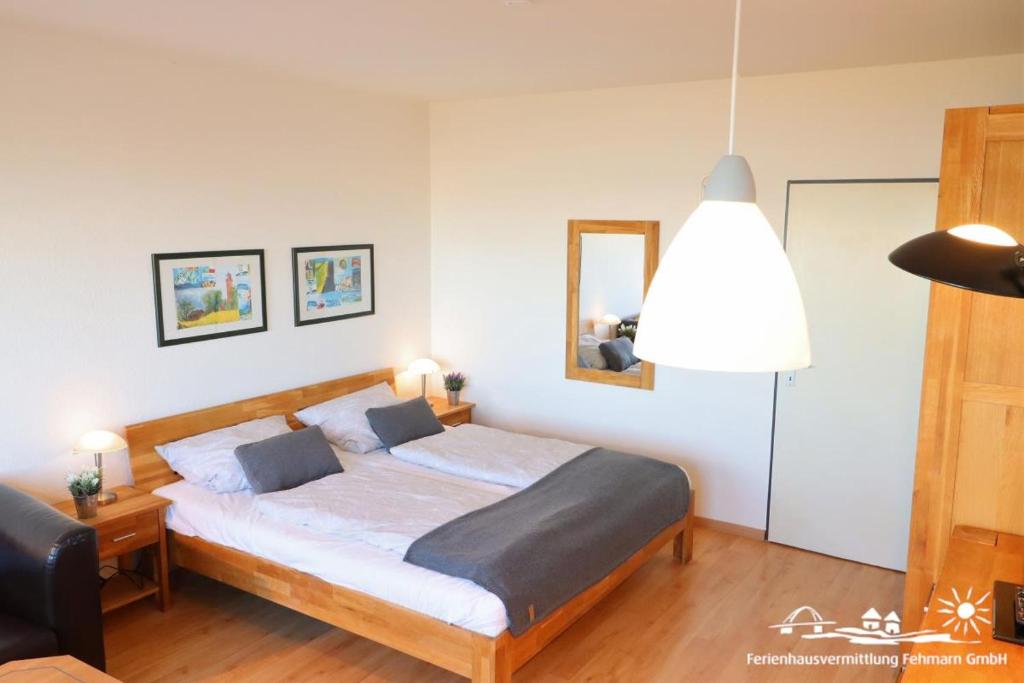 Postel nebo postele na pokoji v ubytování 34 Ferienwohnung App.58-410