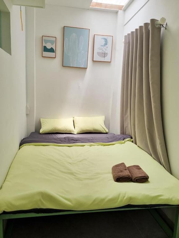 Postel nebo postele na pokoji v ubytování Anh Quân House