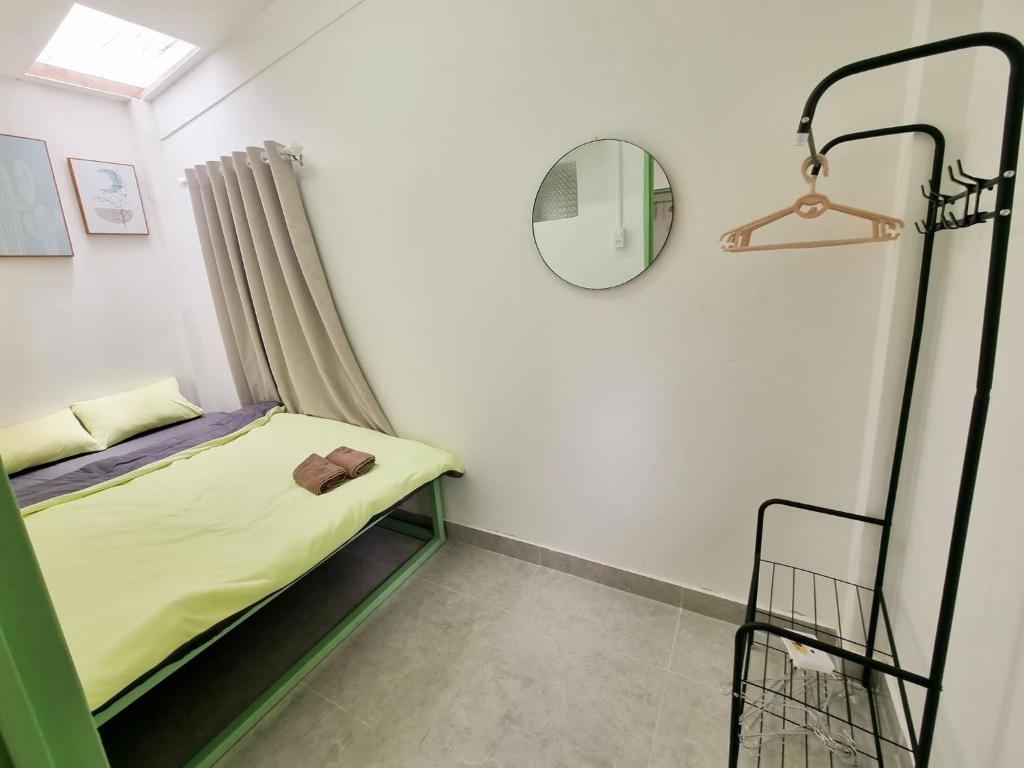 Postel nebo postele na pokoji v ubytování Anh Quân House