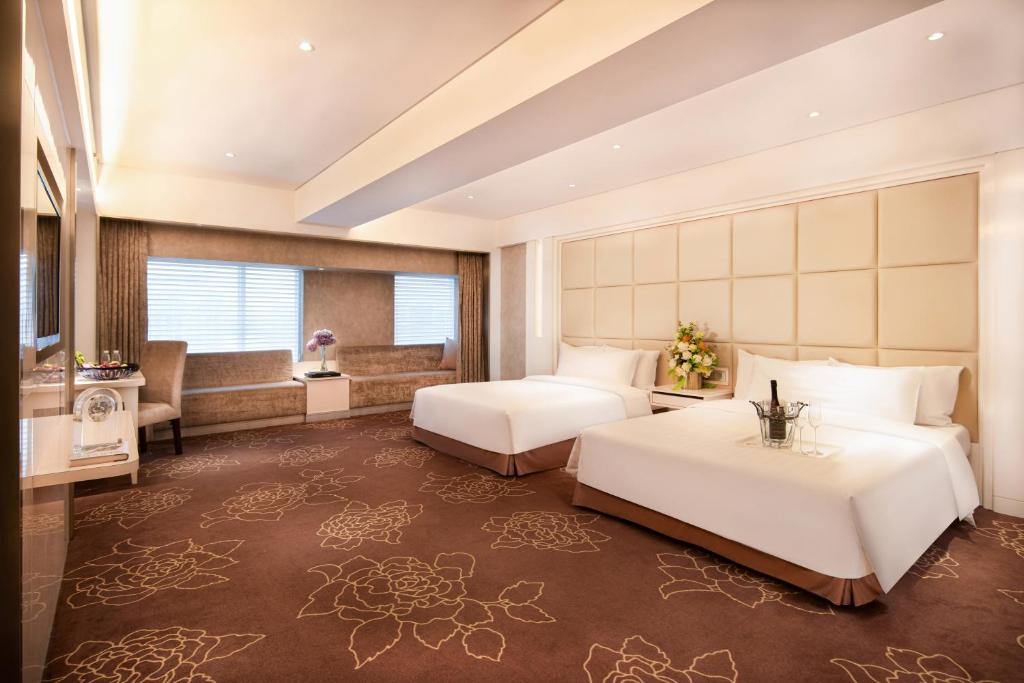 Postel nebo postele na pokoji v ubytování Rio Hotel