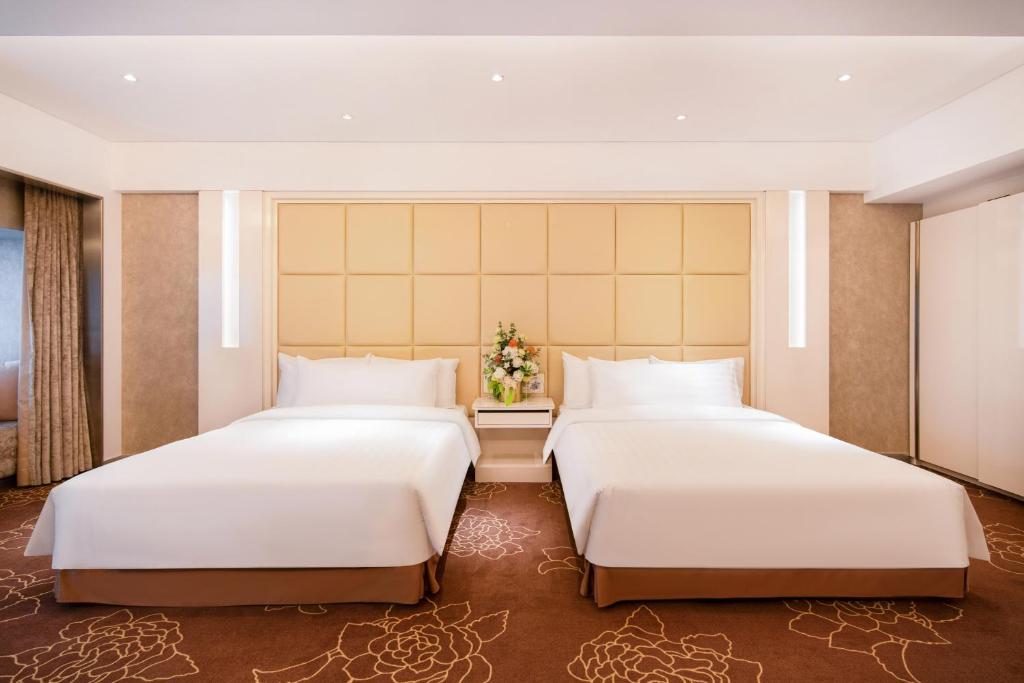 Postel nebo postele na pokoji v ubytování Rio Hotel
