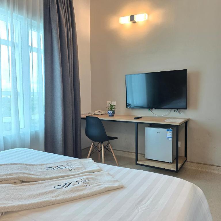 TV a/nebo společenská místnost v ubytování Serapi Verdure Hotel