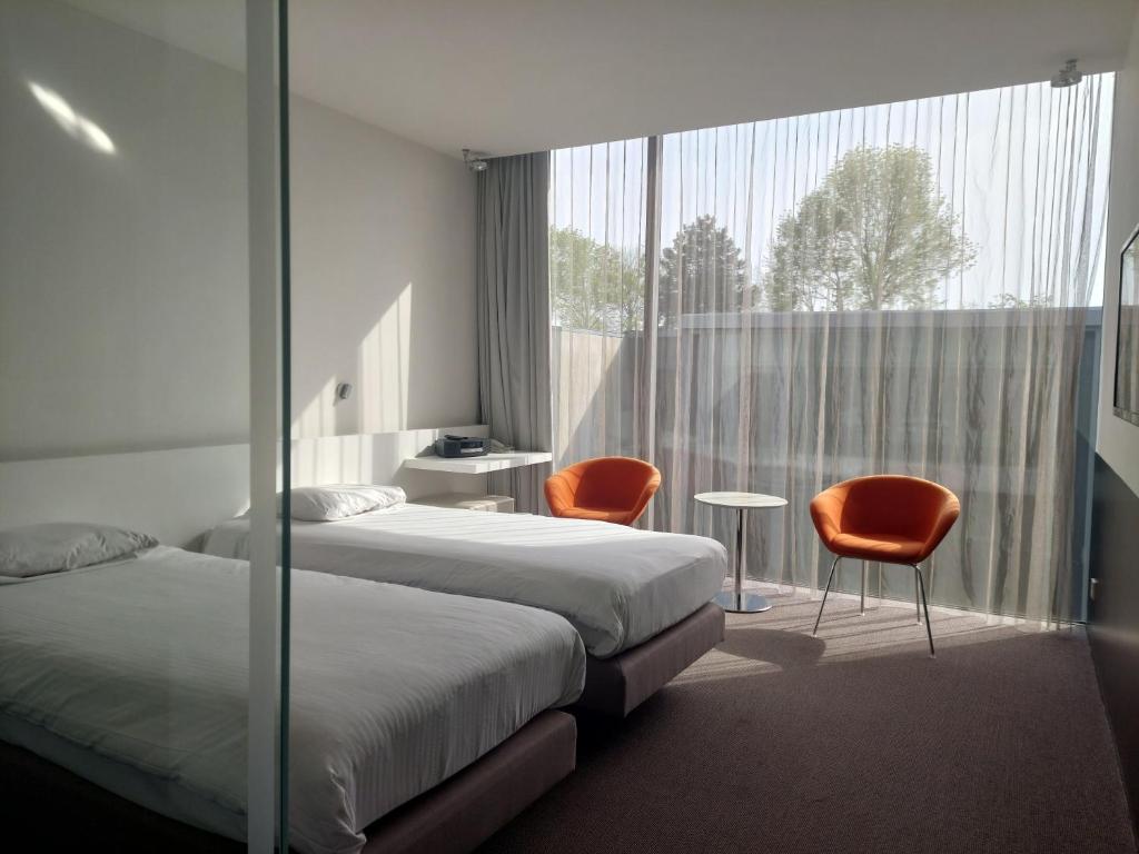 Postel nebo postele na pokoji v ubytování D-Hotel