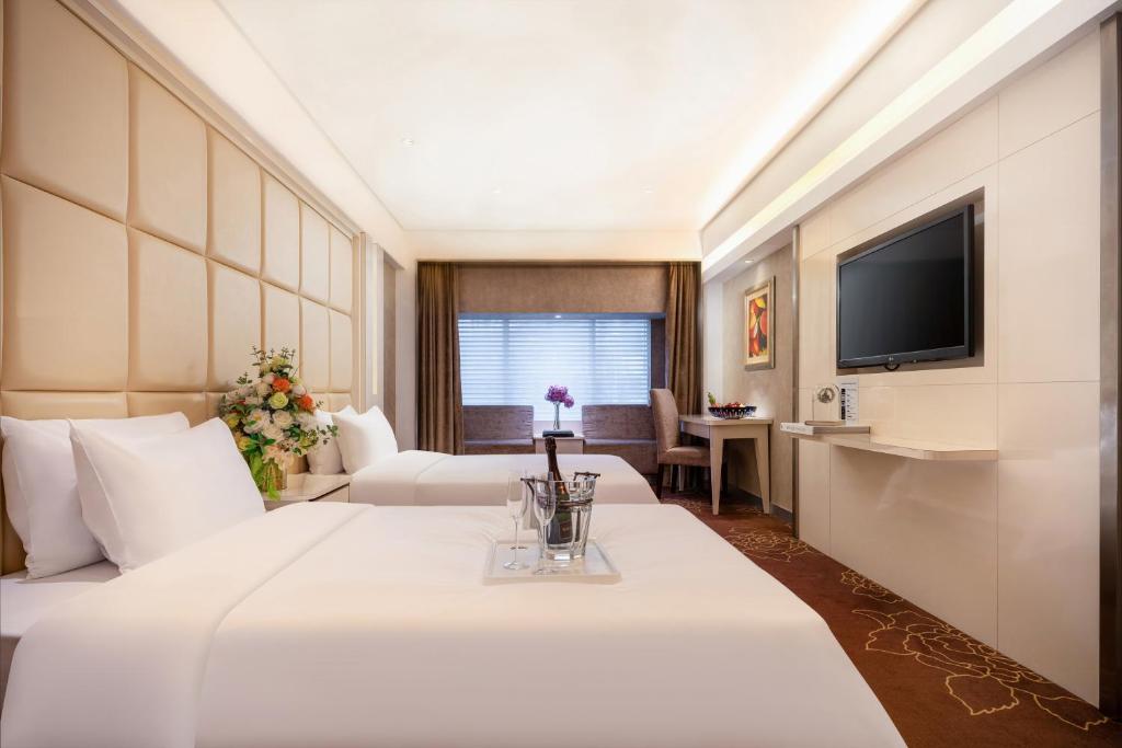 Postel nebo postele na pokoji v ubytování Rio Hotel