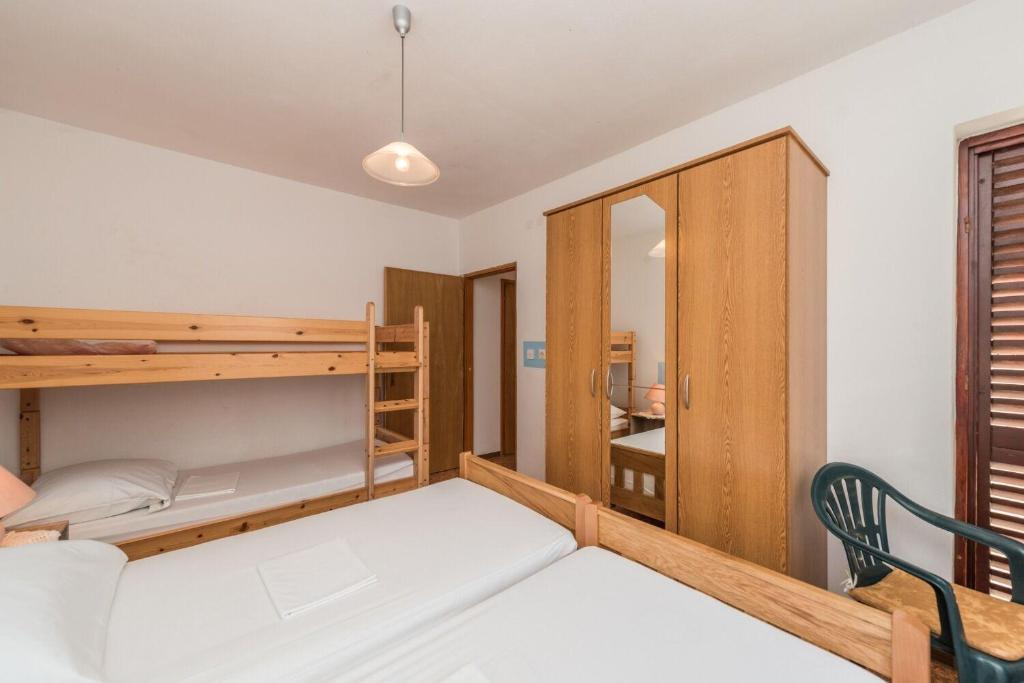 Łóżko lub łóżka w pokoju w obiekcie Apartments Jadra