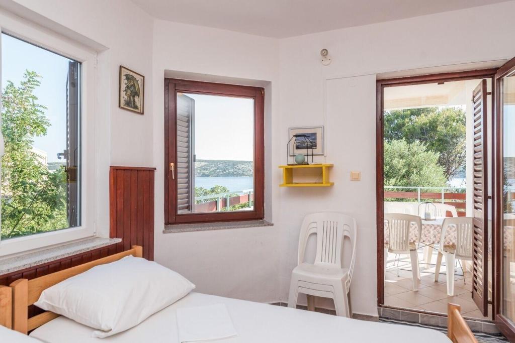 Łóżko lub łóżka w pokoju w obiekcie Apartments Jadra