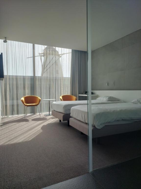Postel nebo postele na pokoji v ubytování D-Hotel