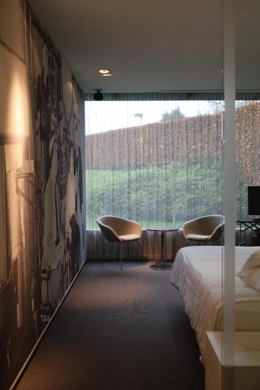 Postel nebo postele na pokoji v ubytování D-Hotel