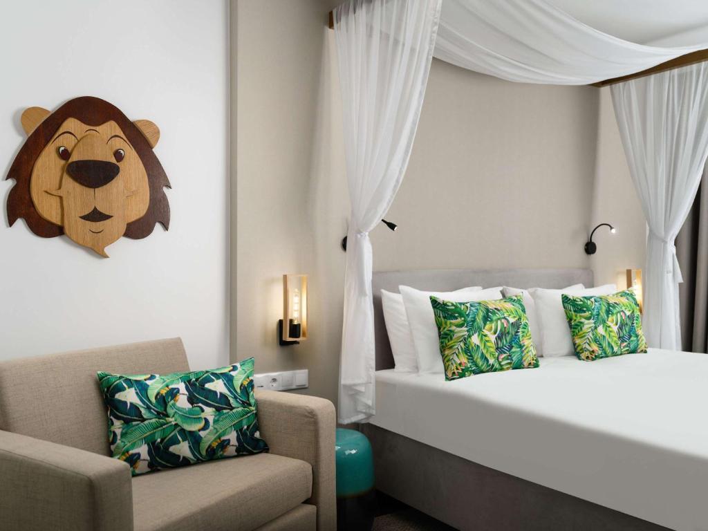Postel nebo postele na pokoji v ubytování Mövenpick Balaland Resort Lake Balaton