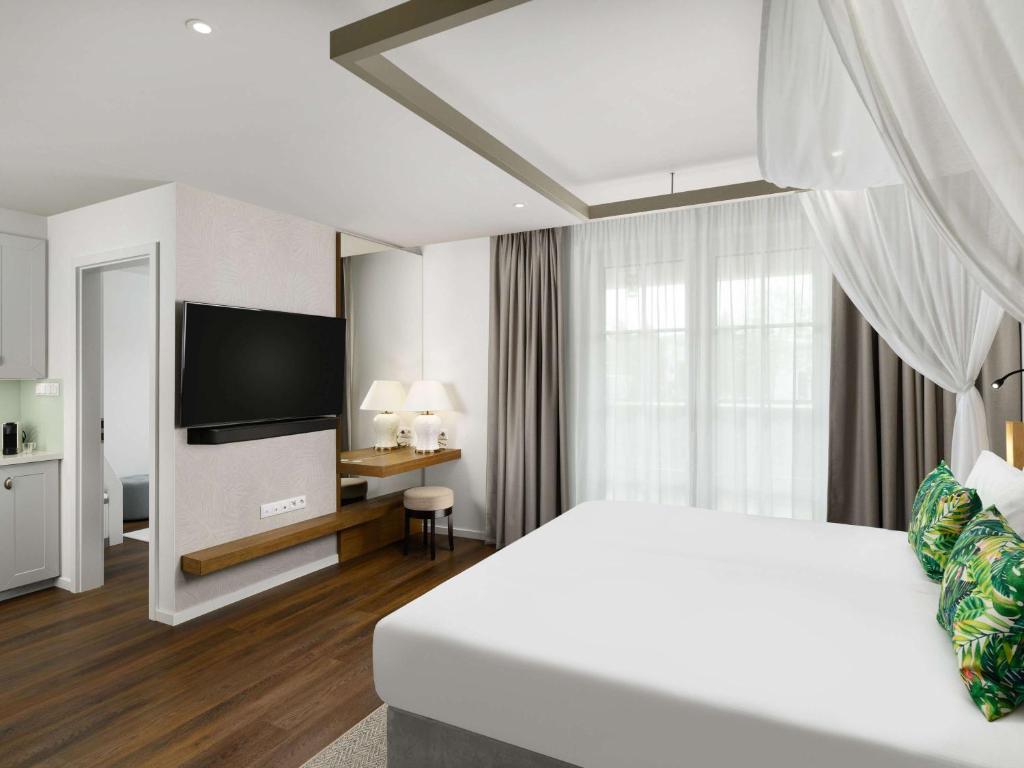 Postel nebo postele na pokoji v ubytování Mövenpick Balaland Resort Lake Balaton