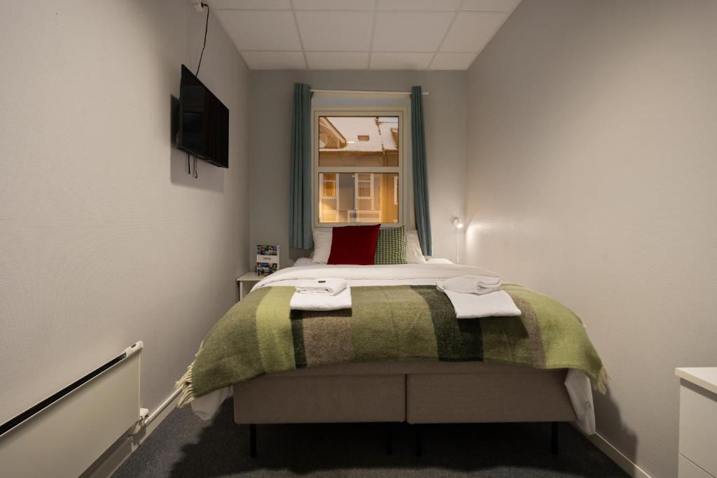 Enter Skansen Hotelにあるベッド