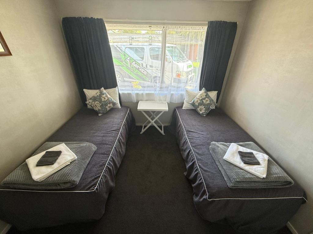 Letto o letti in una camera di Accommodation Gateway Motel