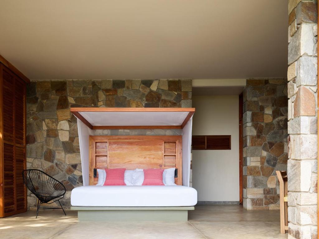 Postel nebo postele na pokoji v ubytování Cocolia Hotel