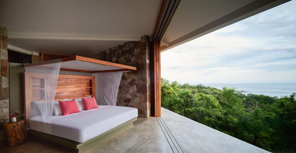 Postel nebo postele na pokoji v ubytování Cocolia Hotel