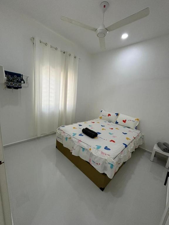 Postel nebo postele na pokoji v ubytování Homestay Bajet Cikgu Amin