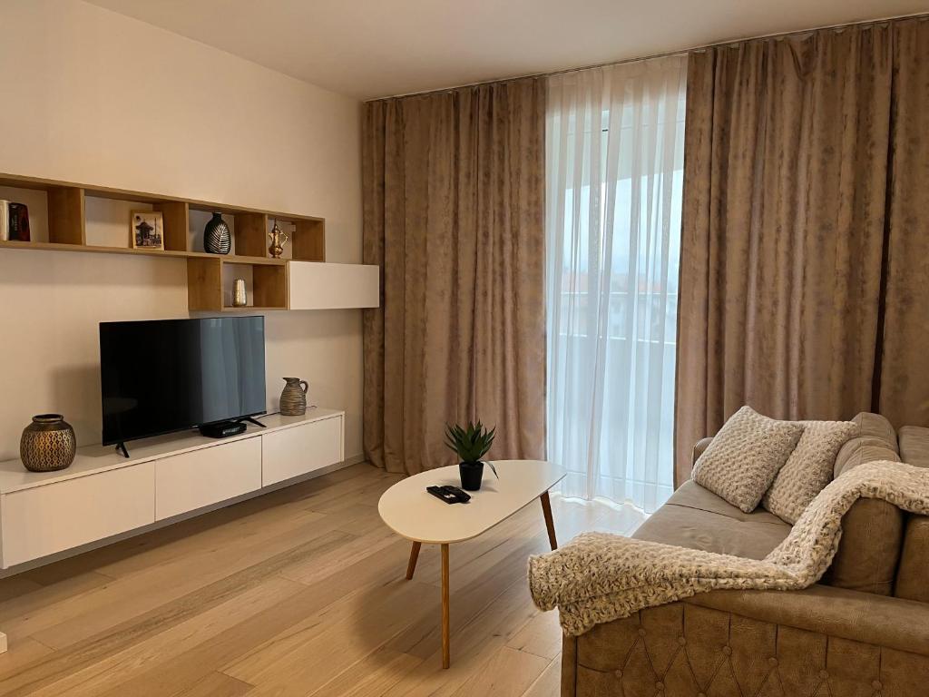 TV a/nebo společenská místnost v ubytování Sarajevo Waves Aparthotel
