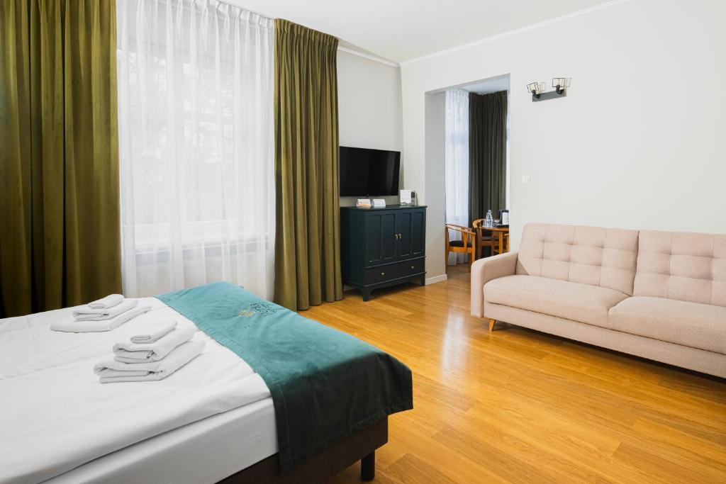 Postel nebo postele na pokoji v ubytování Perła Sudetów by Stay inn Hotels