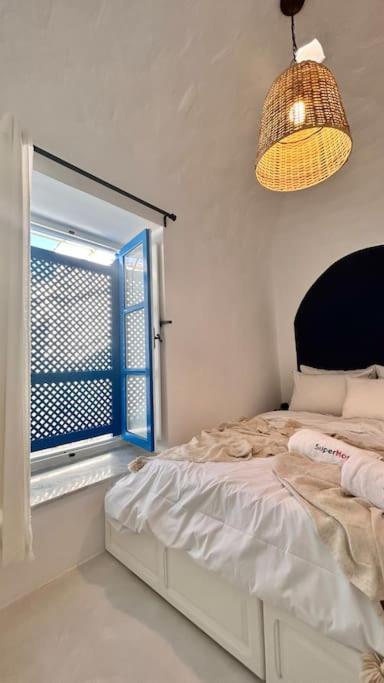 Voodi või voodid majutusasutuse Zina Apartment Sidi Bou Said toas