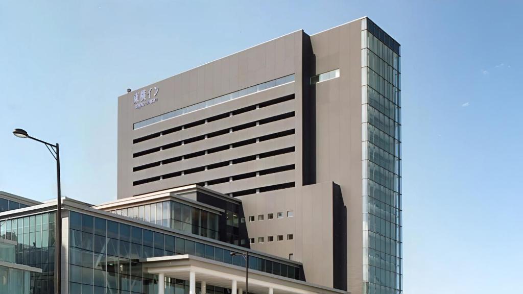 a tall building with a lot of windows at Toyoko Inn Akita-eki Higashi-guchi in Akita