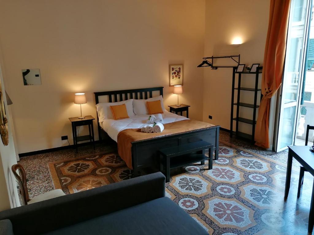 Posteľ alebo postele v izbe v ubytovaní B&B Genova Centro