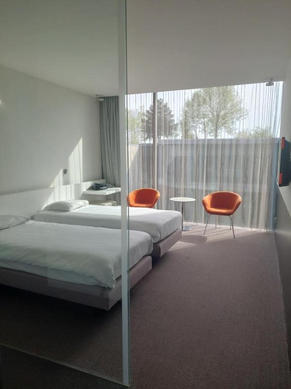 Postel nebo postele na pokoji v ubytování D-Hotel