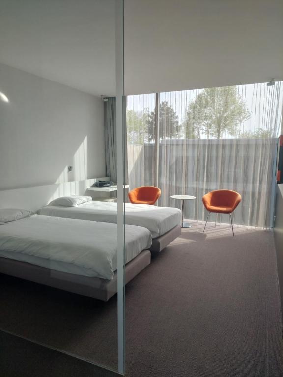 Postel nebo postele na pokoji v ubytování D-Hotel