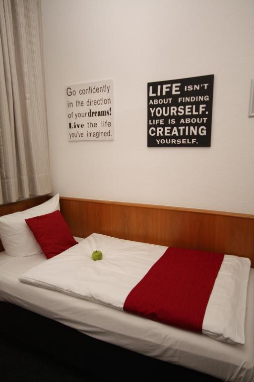 Postel nebo postele na pokoji v ubytování Hotel Heymann