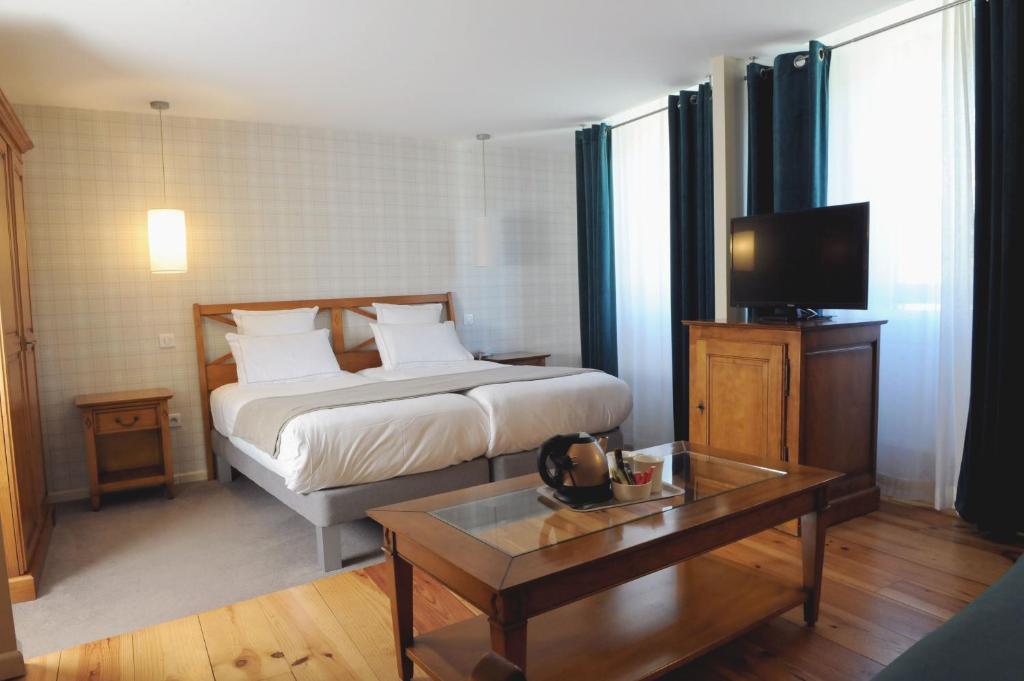 Postel nebo postele na pokoji v ubytování Hôtel d'Angleterre