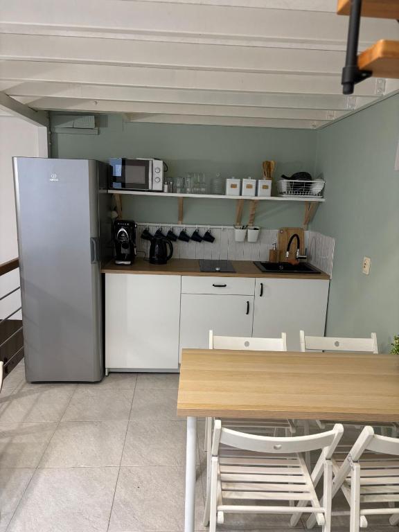 Kuchyň nebo kuchyňský kout v ubytování SheSpace Apartrooms