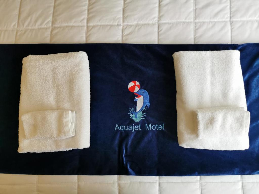 Postel nebo postele na pokoji v ubytování Aquajet Motel