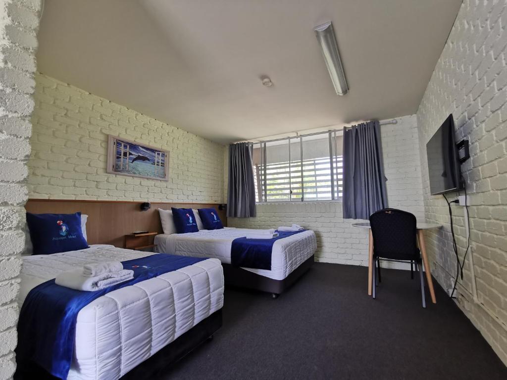 Postel nebo postele na pokoji v ubytování Aquajet Motel