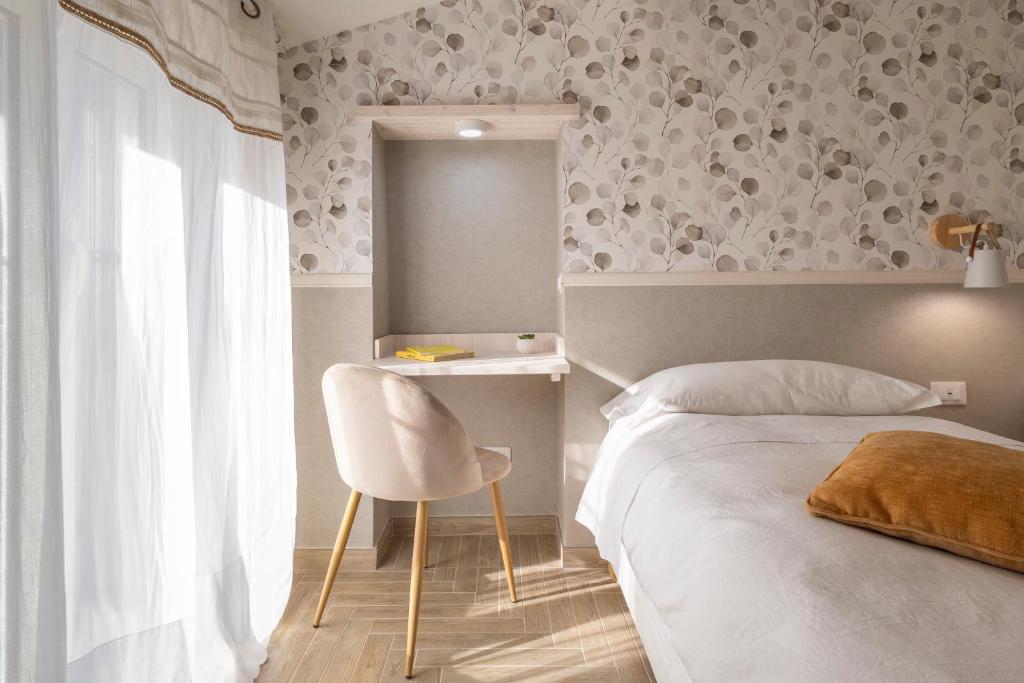 Łóżko lub łóżka w pokoju w obiekcie B&B La Rocca