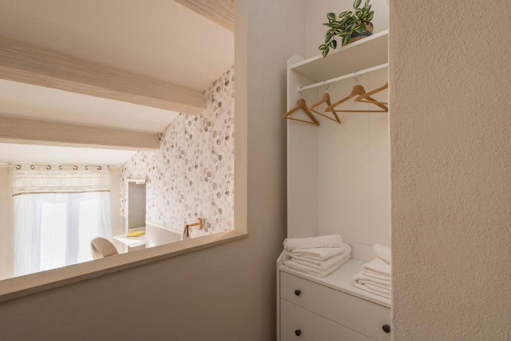 Łóżko lub łóżka w pokoju w obiekcie B&B La Rocca