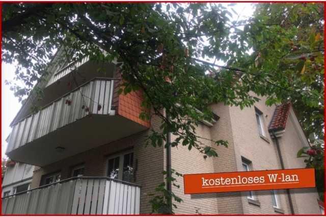 a building with a balcony on top of it at Hideaway - Ibbenbüren in Ibbenbüren