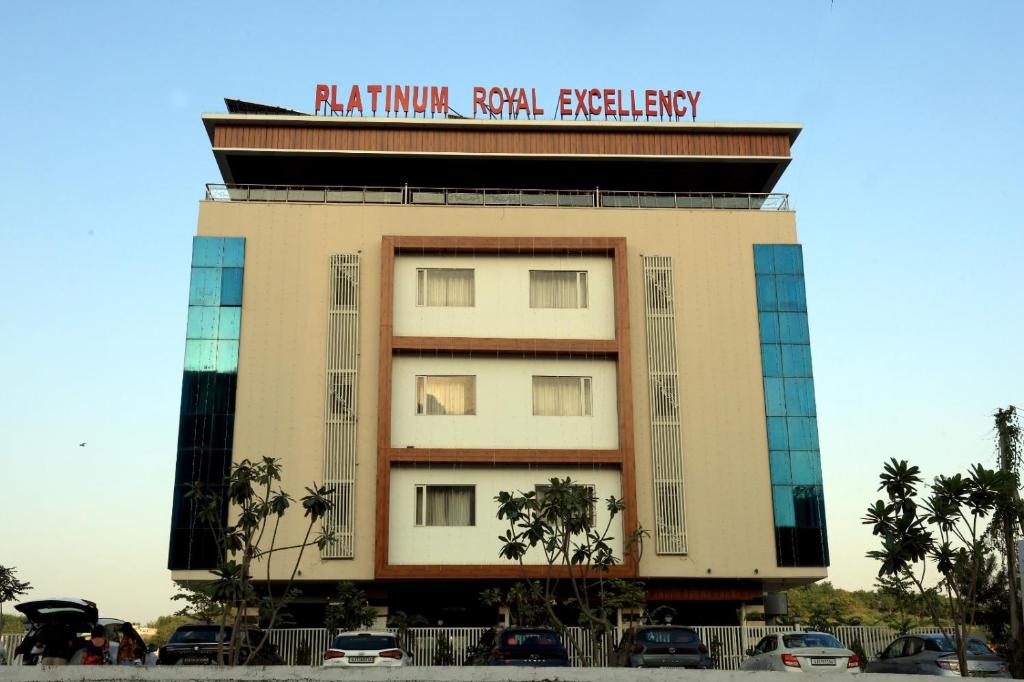 a building with a sign on top of it at Platinum Royal Excellency in Udaipur