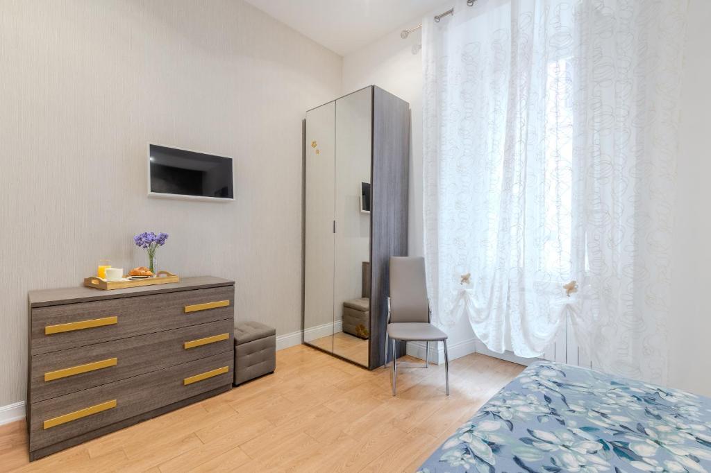 Televízia a/alebo spoločenská miestnosť v ubytovaní Casa Fabio