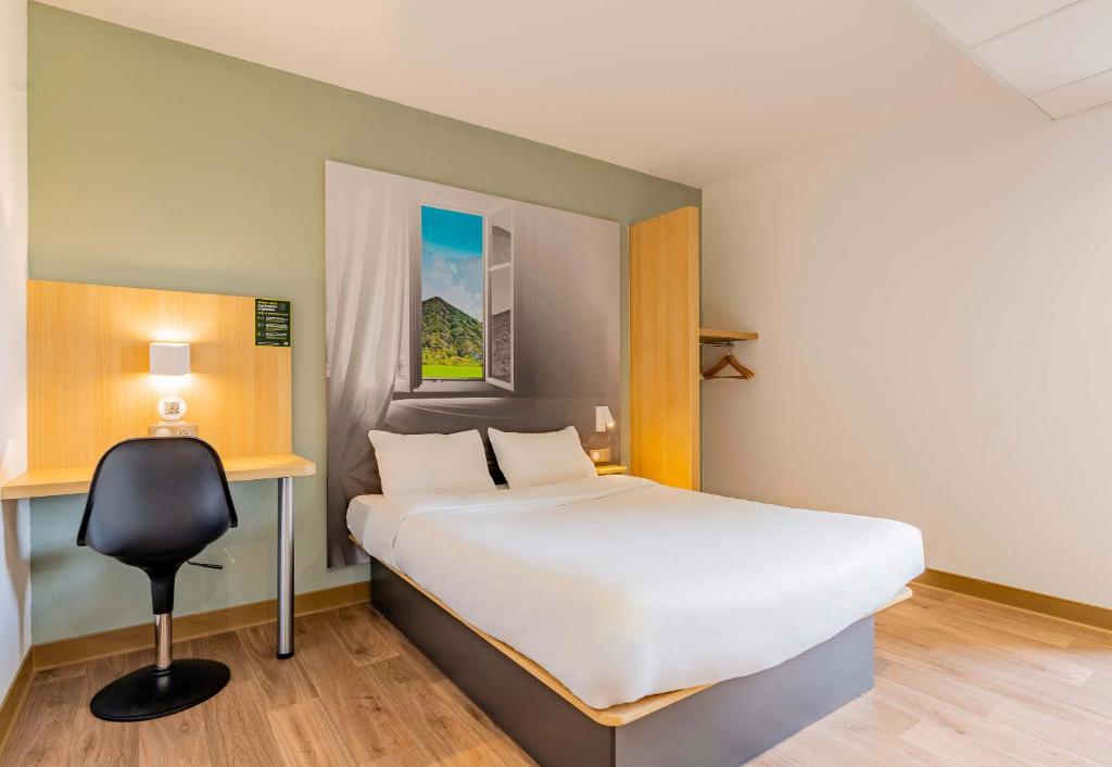 Postel nebo postele na pokoji v ubytování B&B HOTEL Béthune Bruay-la-Buissière